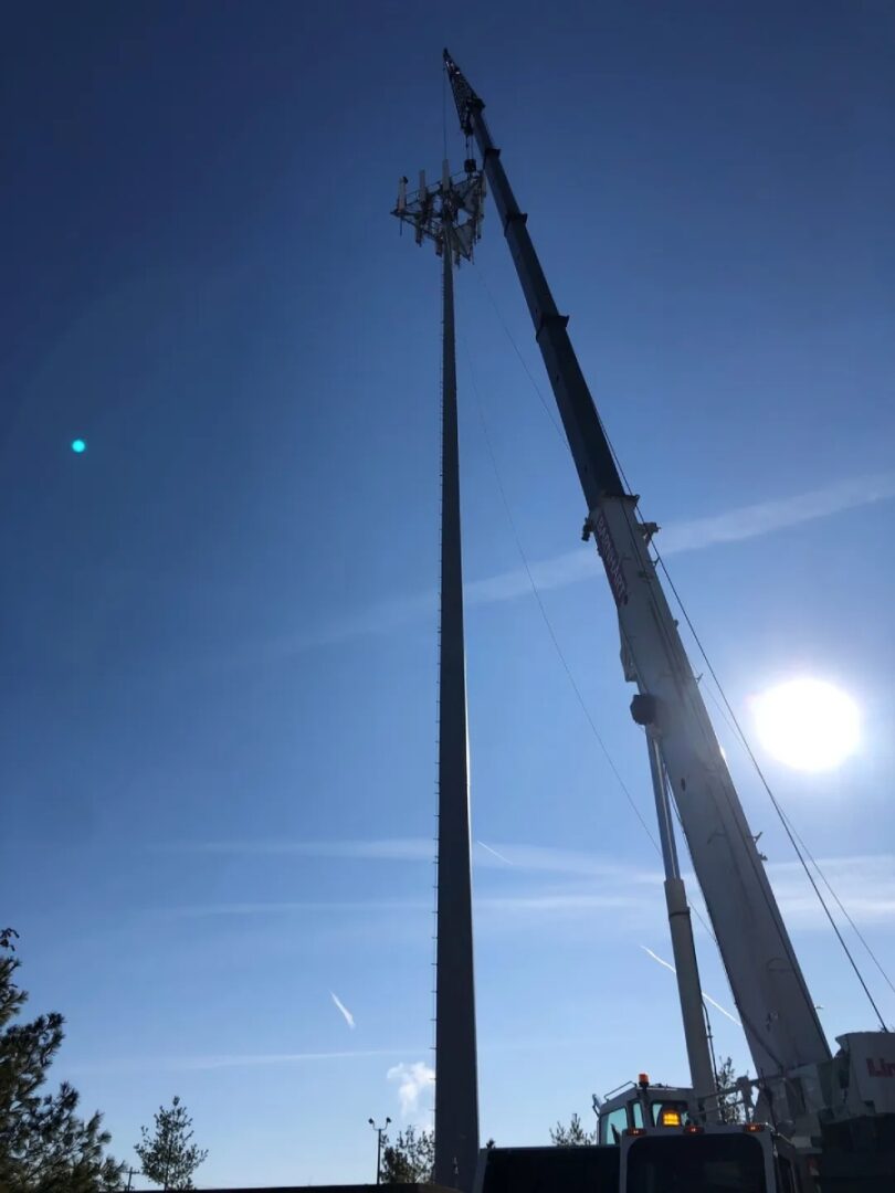 A crane working for a mobile networking pole